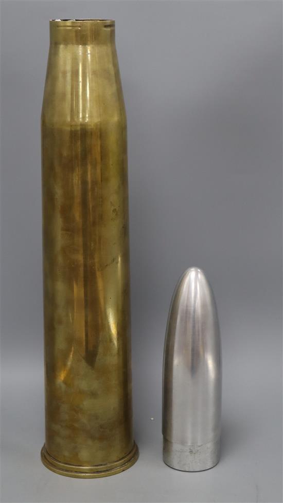 A 1943 English shell casing with a made up shell mount